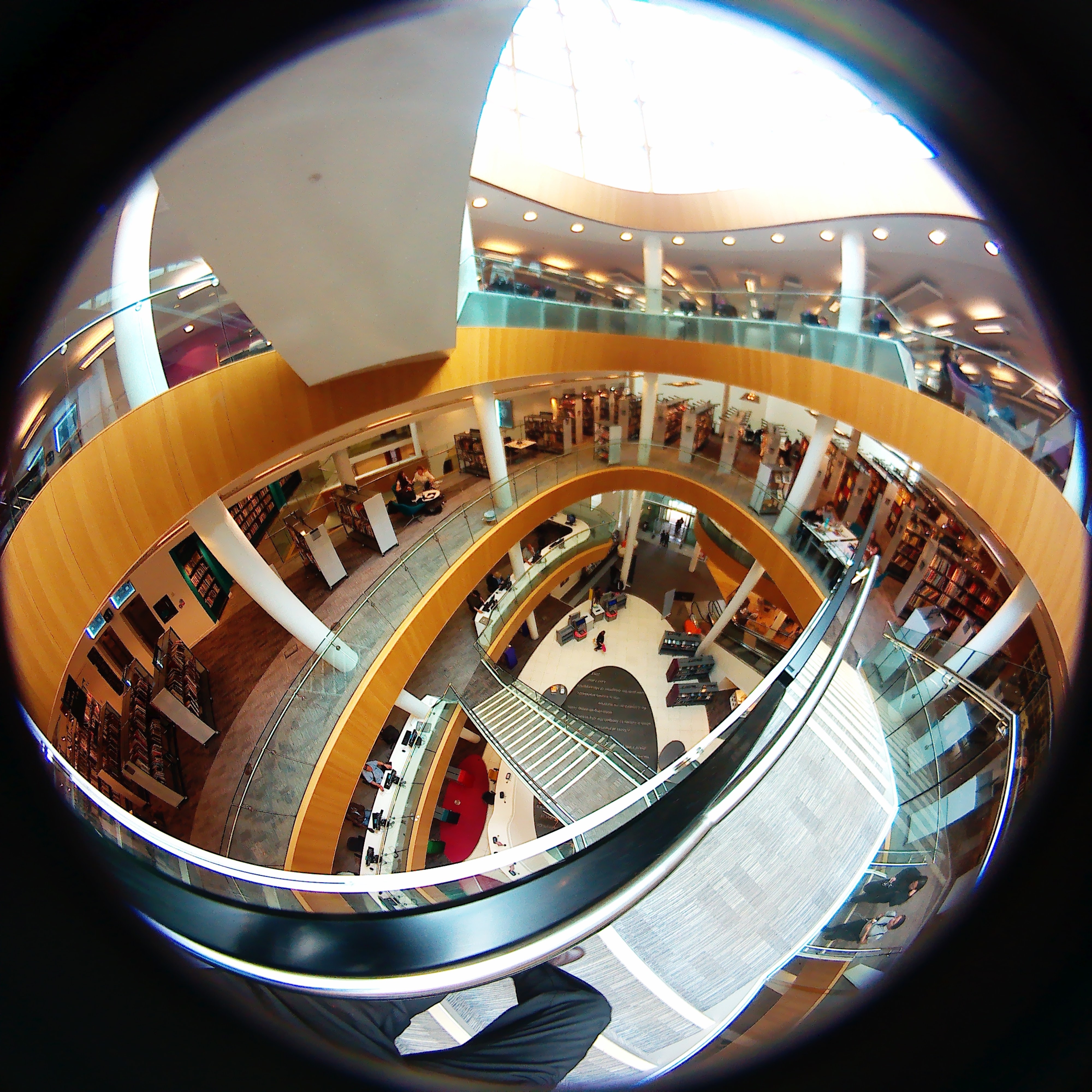 Multi-storey atrium with spiral staircase — fisheye lens