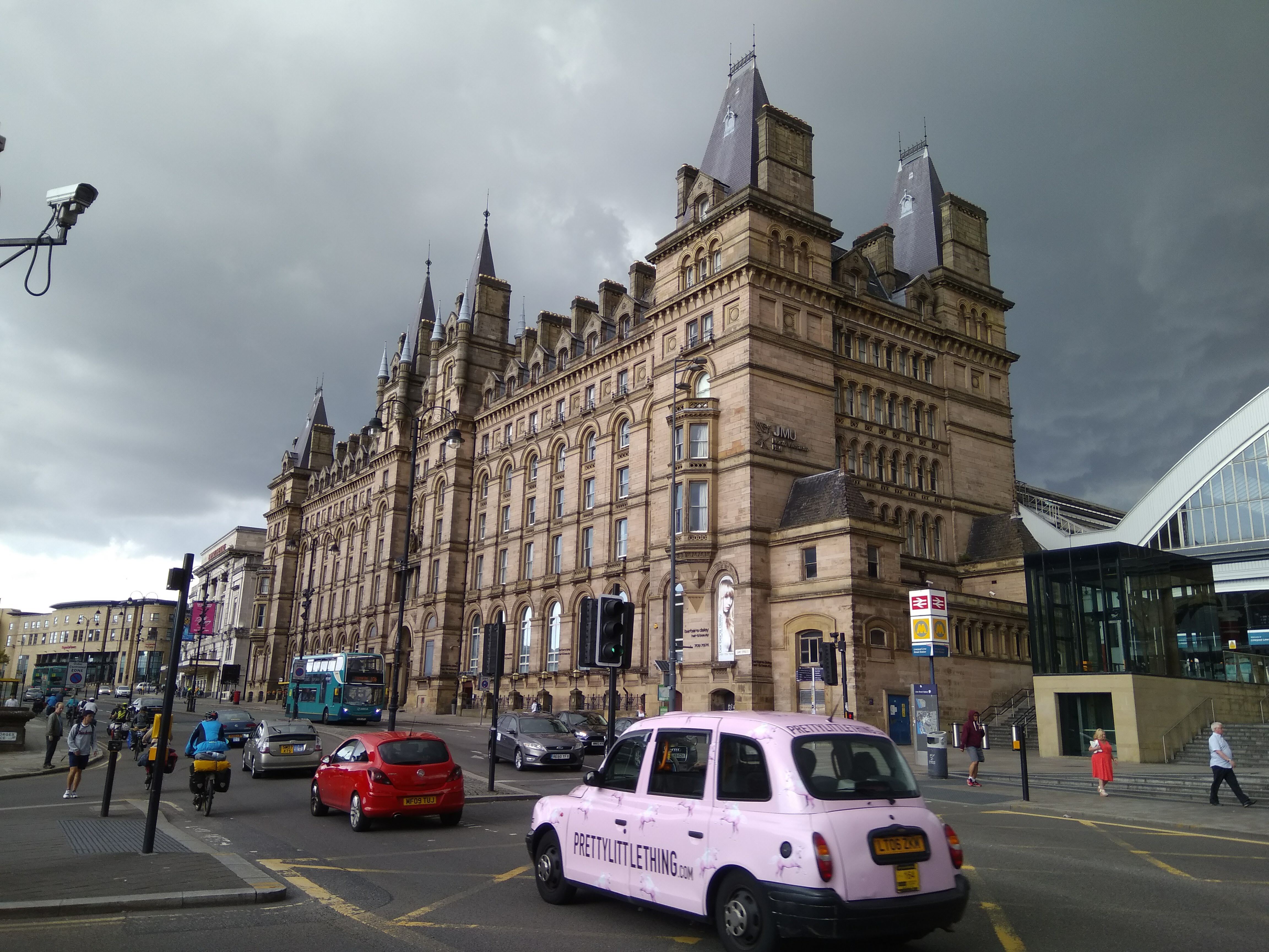 Gothic Victorian building under a dramatic stormy sky